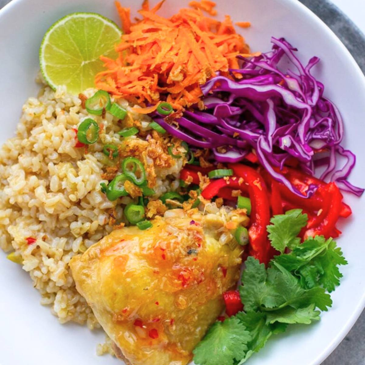 A flavorful Thai-Style Brown Rice & Chicken dish with tender chicken, aromatic herbs, and vegetables, all simmered in a savory coconut curry sauce.







