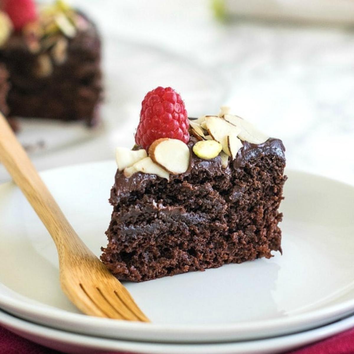 A rich and moist Vegan Chocolate Cake made with dairy-free ingredients, layered with a silky chocolate frosting, perfect for any occasion.








