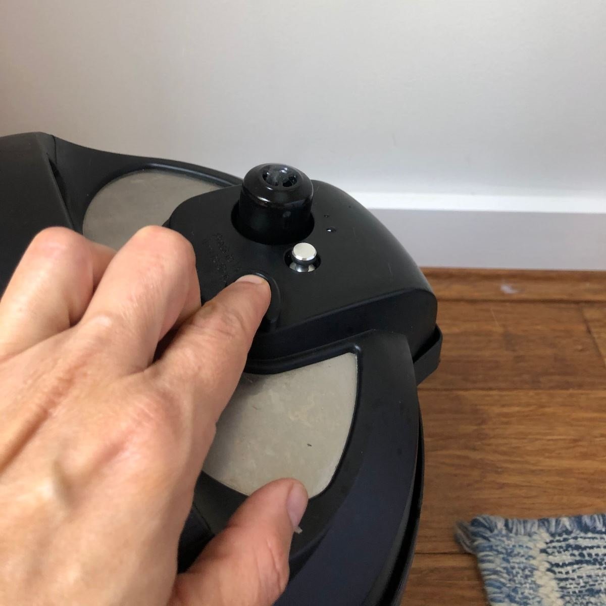 hand on lid of instant pot