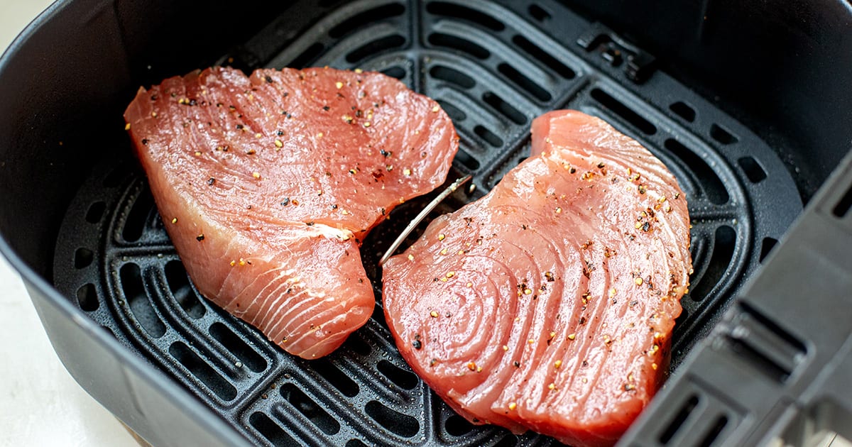 tuna steaks inside air fryer basket