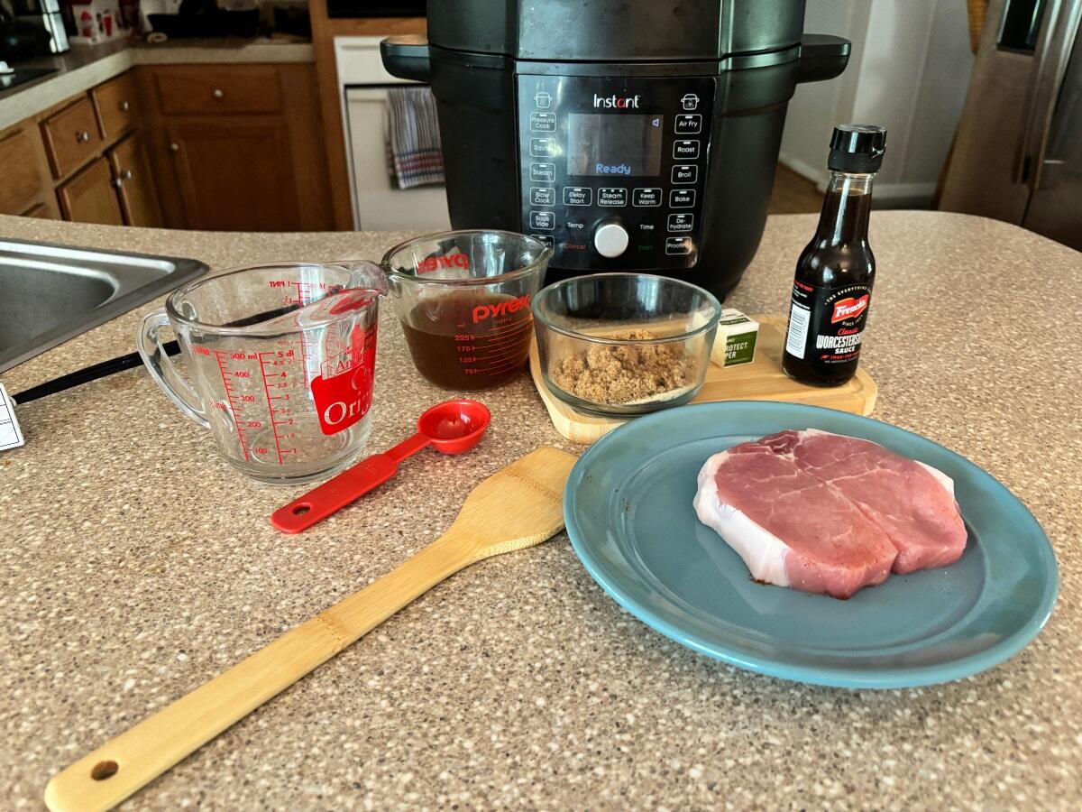 steak, seasonings, kitchen utensils for cooking in an instant pot
