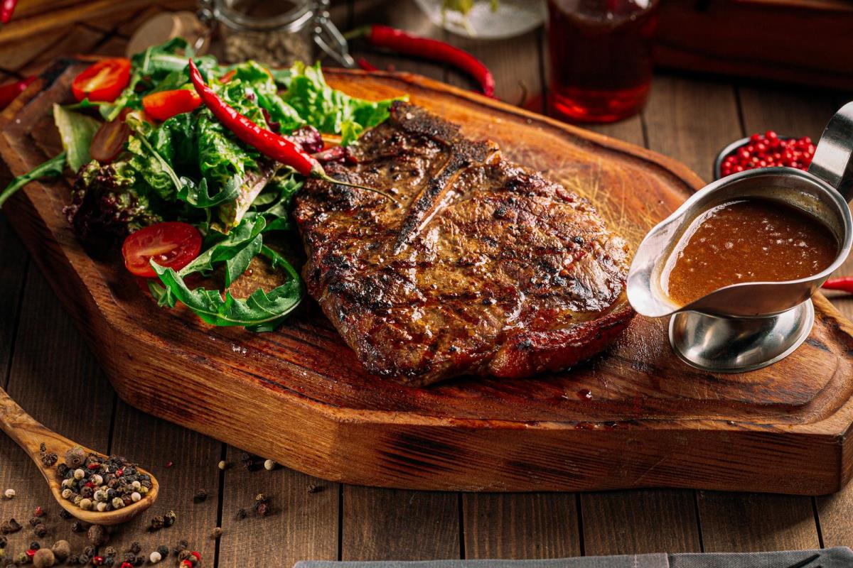 grilled beef ribeye steak with pepper sauce