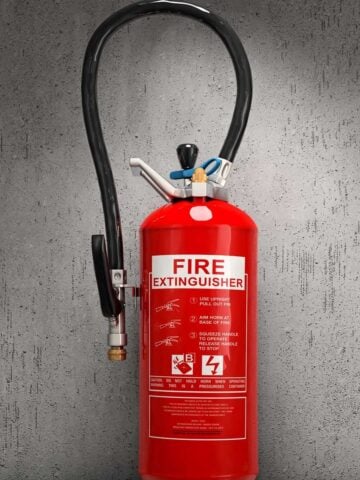 fire extinguisher on concrete wall