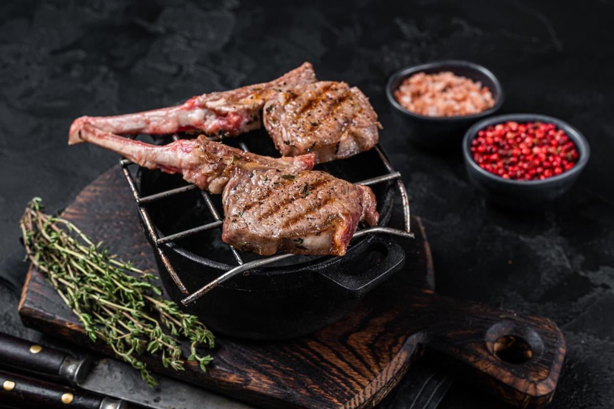 grilled lamb mutton meat chops steaks on a grill