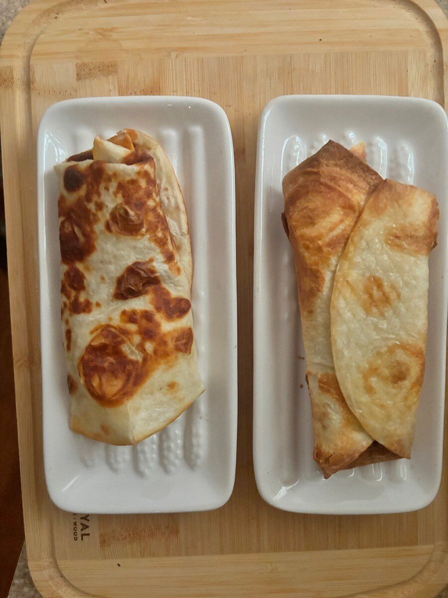 two burritos in single-use plates