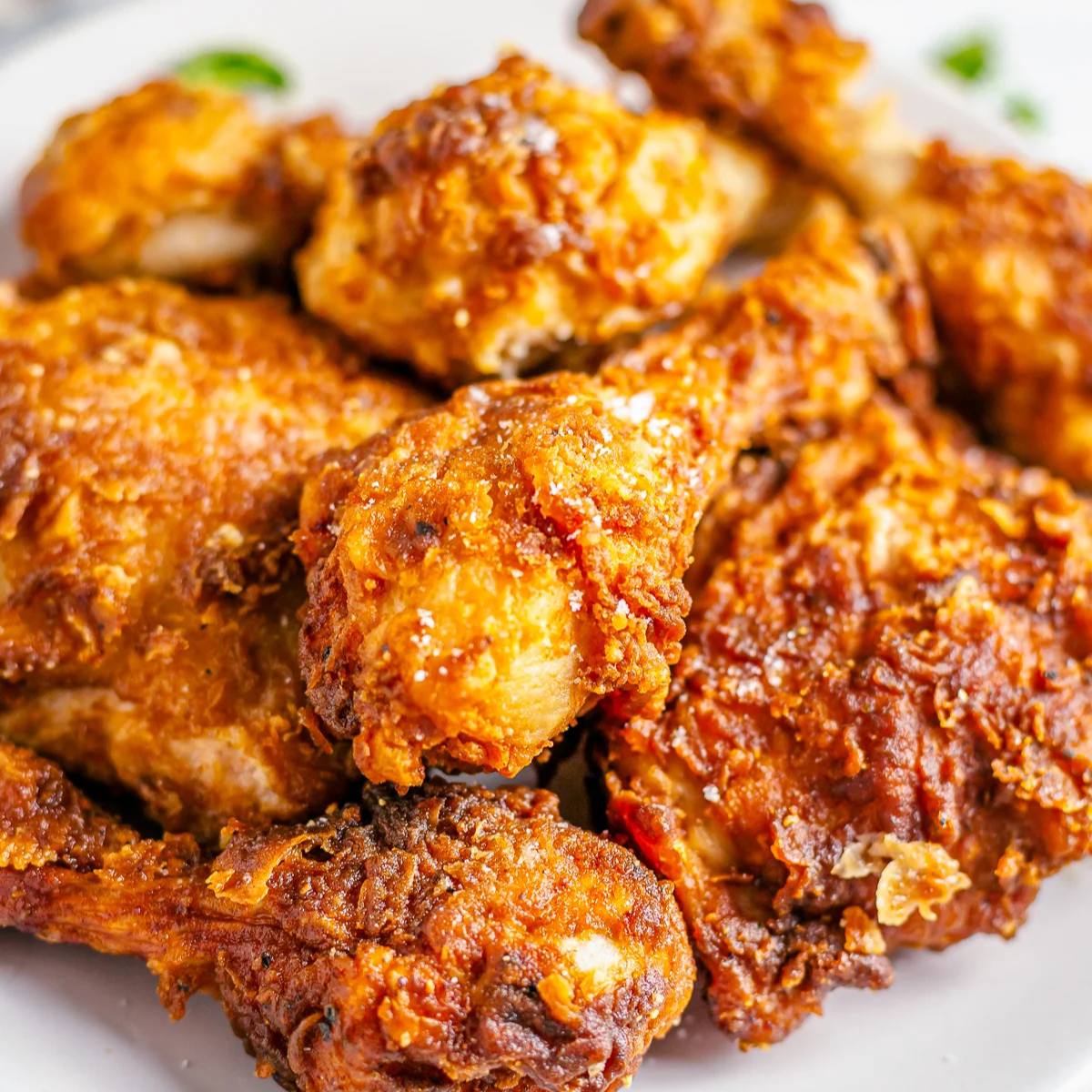 A plate of crispy, golden-brown fried chicken.