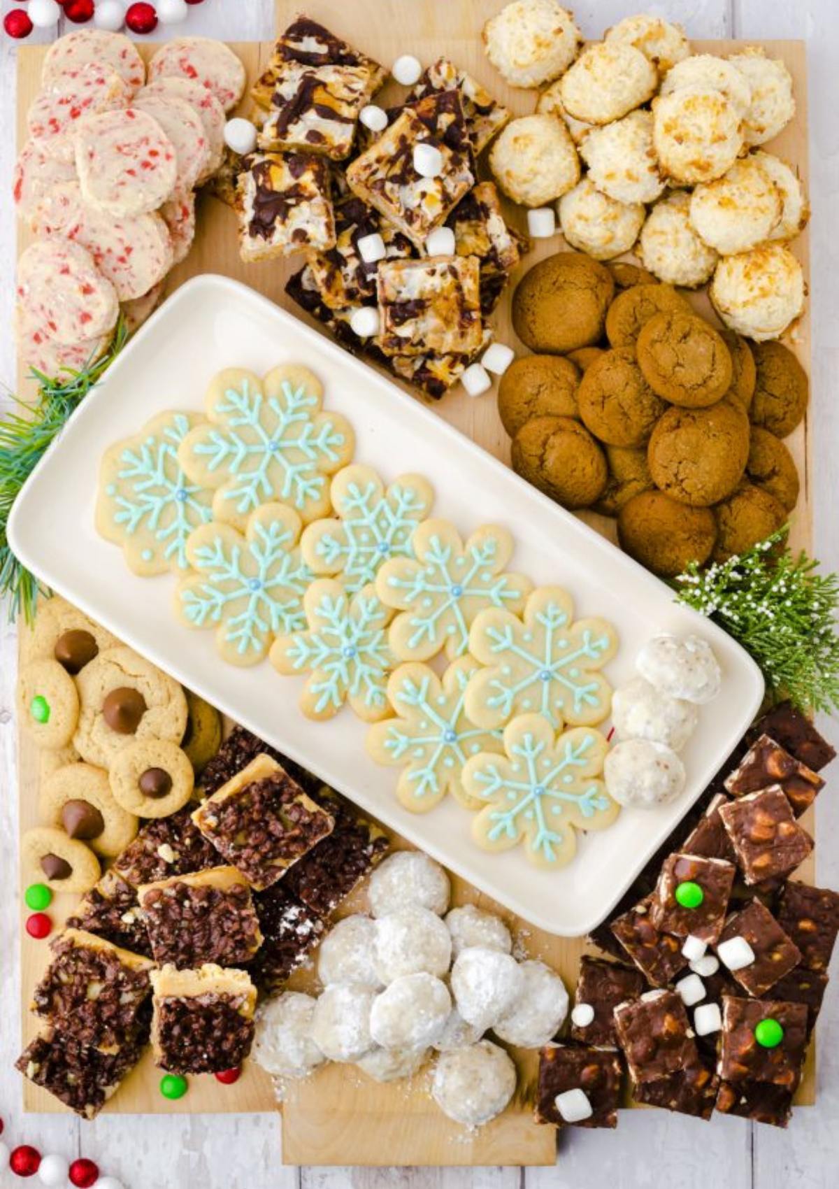 The board includes sugar cookies, gingerbread cookies, chocolate chip cookies, shortbread cookies, and other holiday-themed goodies.