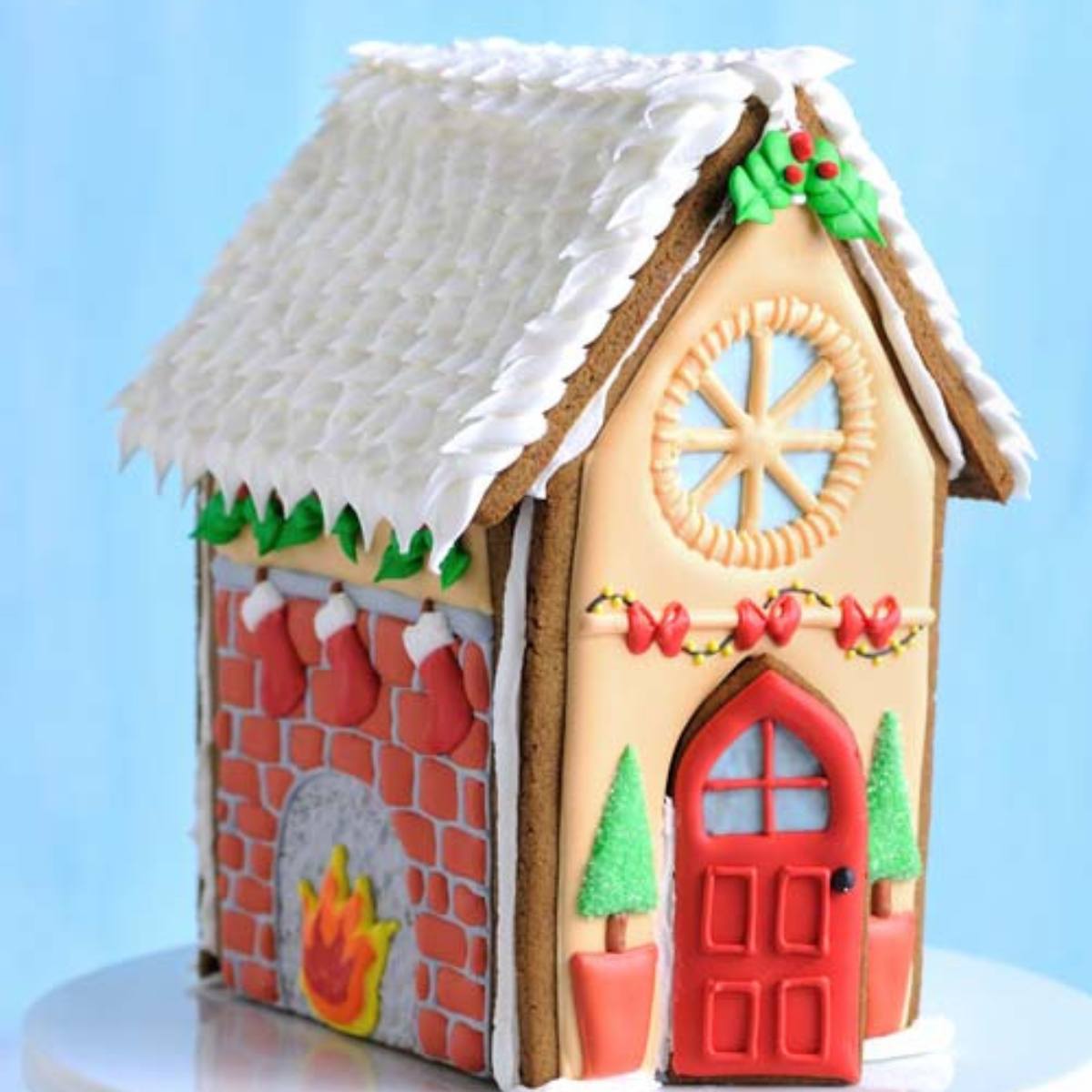 A charming gingerbread house with a detailed fireplace, decorated with icing and candy.