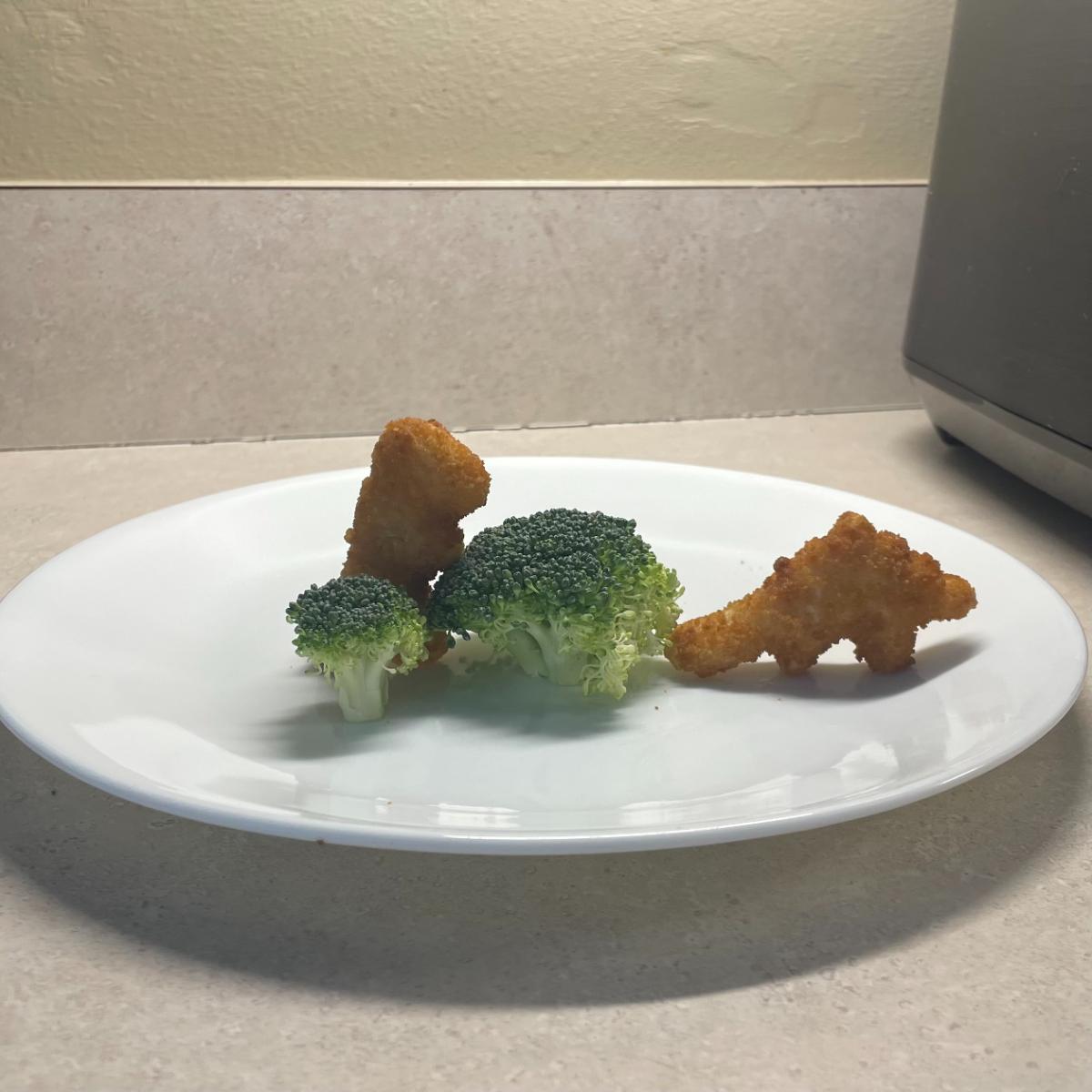 Dino Nuggets and broccoli on a plate