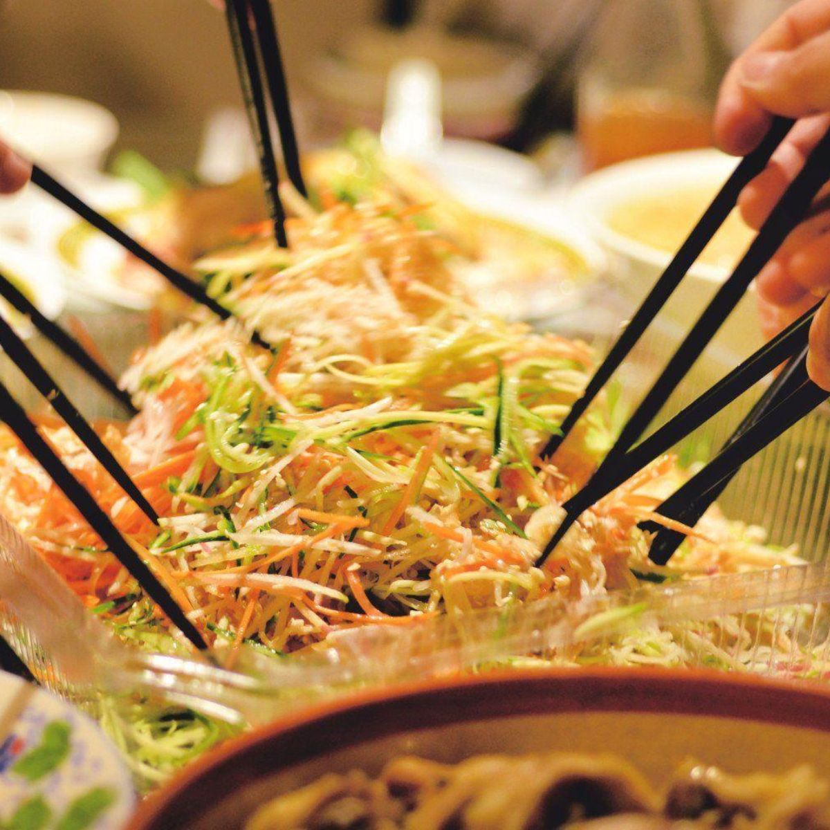 Coleslaw in a bowl and chopsticks