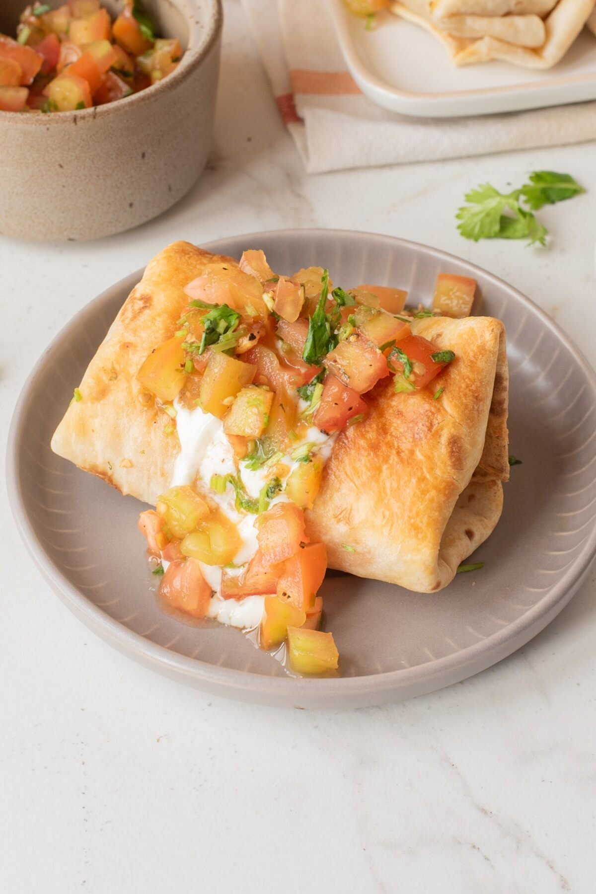 air fryer chimichingas on a white plate