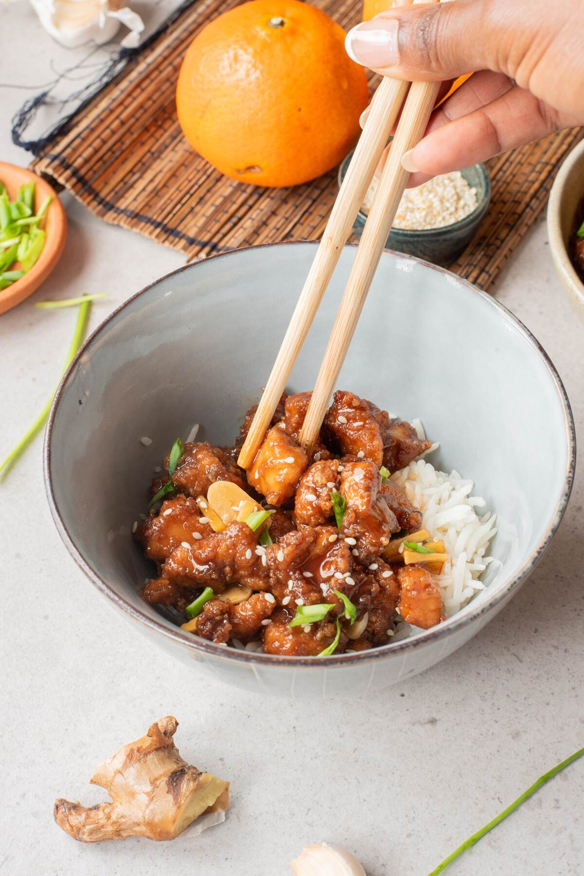 exclusive air fryer spicy orange chicken in a white dish