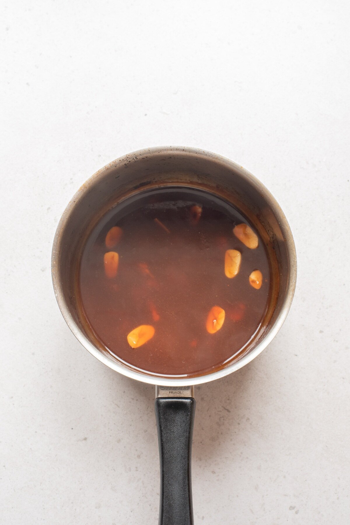 whisk orange juice, soy sauce, honey, hot sauce, vinegar, ginger and garlic in a sauce pan