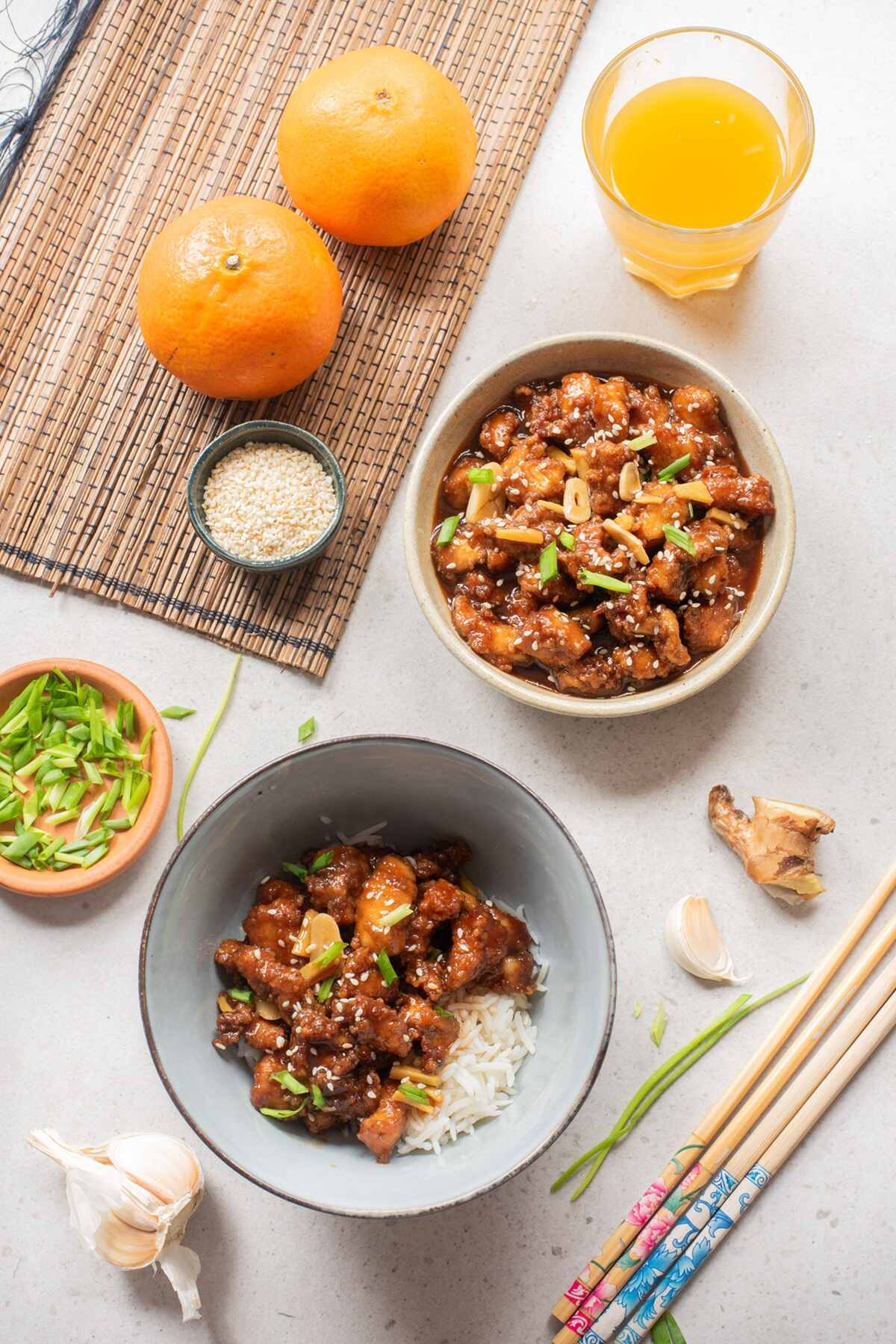 Crispy chicken with a sticky, glossy, sweet, and tangy orange glaze