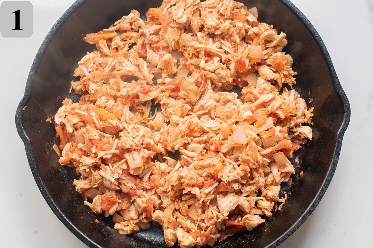 Sautรฉ diced onion in olive oil over medium heat until soft, add shredded chicken, salsa, and spices, cook for a few minutes to blend flavors, then season with salt and pepper to taste.