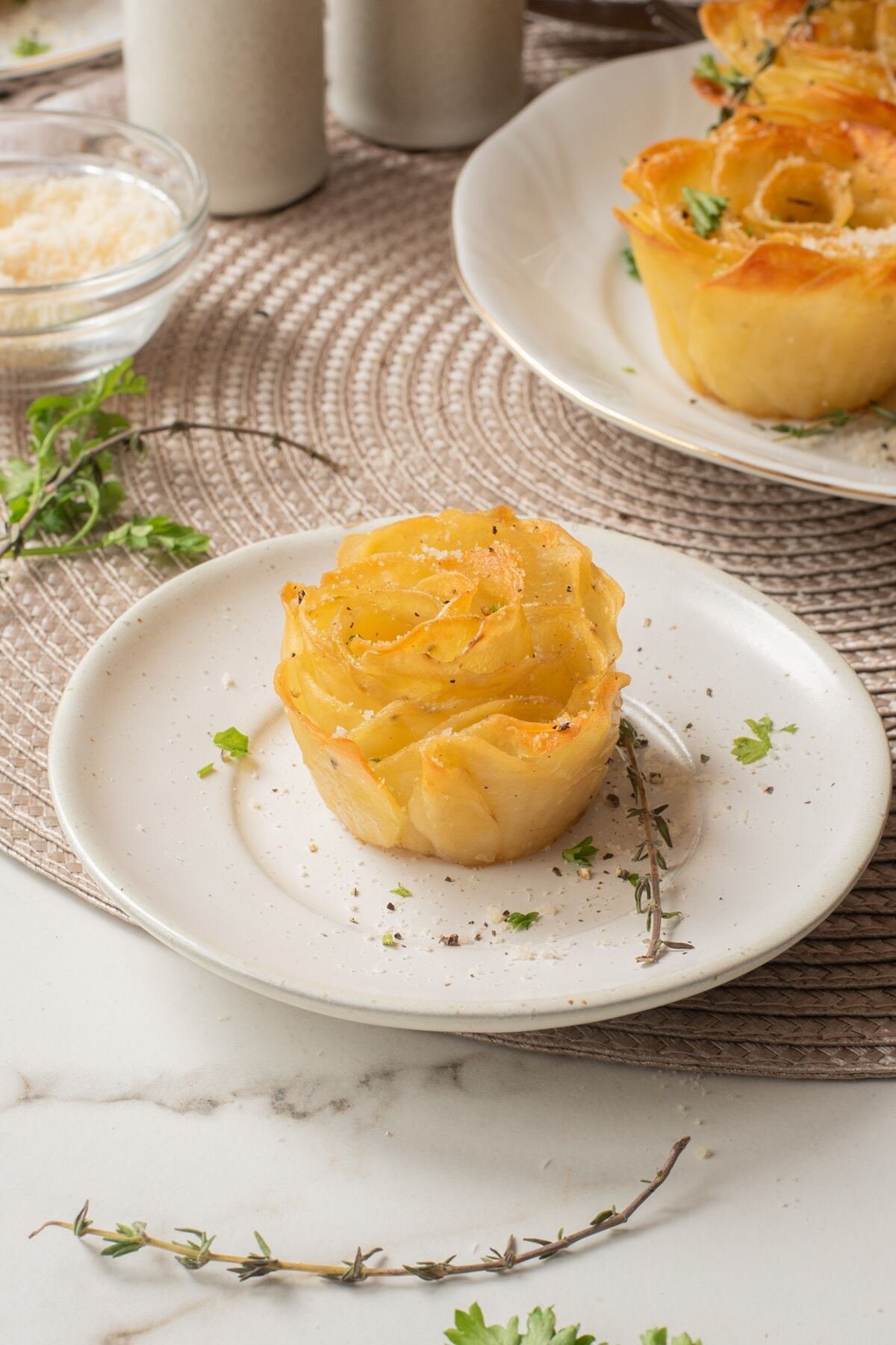 one air fryer potato roses on a white plate