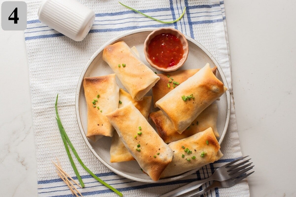 Preheat to 380ยฐF (195ยฐC), lightly spray egg rolls, and air fry seam-side down for 10โ12 minutes, turning halfway, until golden and crispy.