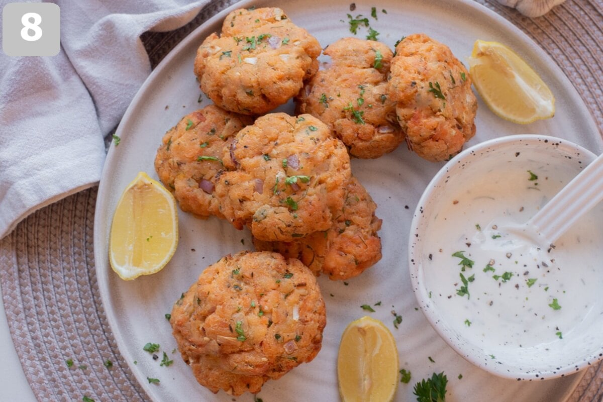 Serve warm air fryer salmon patties with lemon wedges and dipping sauce.