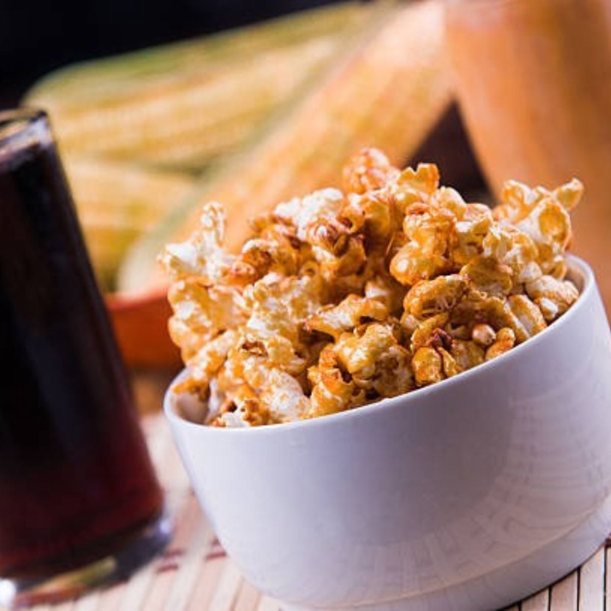 Cracker Jack peanuts in a white bowl with peanuts at the bottom
