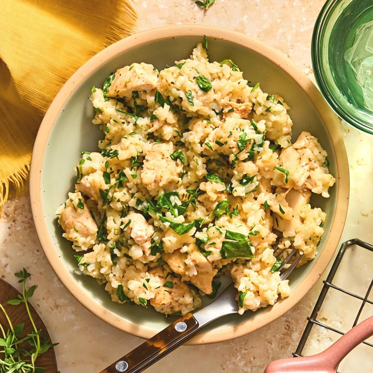 Butter herb chicken and rice bake served in a bowl, an easy dump and bake recipe for dinner