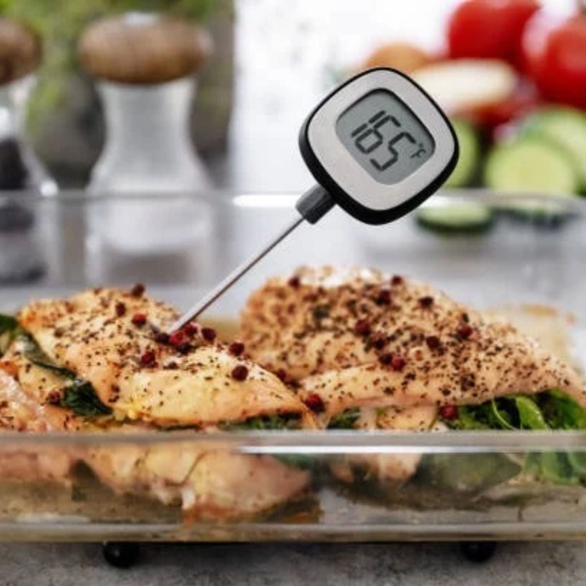 A thermometer reading of 165 degrees F inside the thickest part of a chicken breast