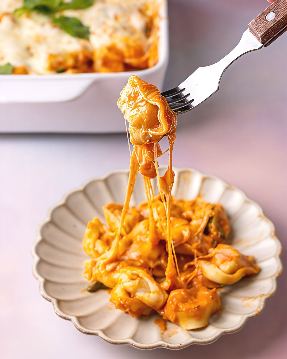 Dump and bake tortellini casserole served on a plate, an easy recipe for dinner