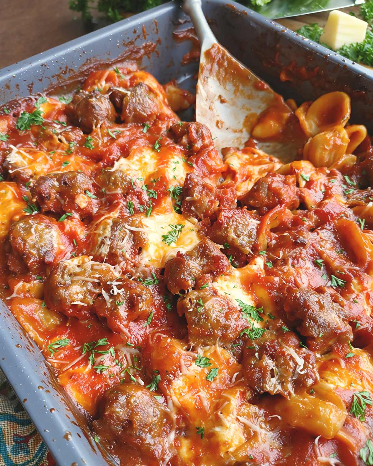 Italian pasta dump and bake casserole with meatballs, marinara sauce, and melted cheese in a baking dish