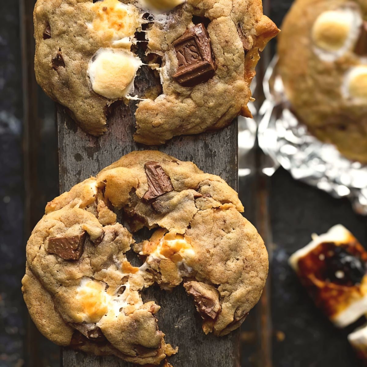 Warm, gooey s'mores cookies packed with melted chocolate chunks and toasted marshmallows, perfect as quick and easy last minute potluck ideas.