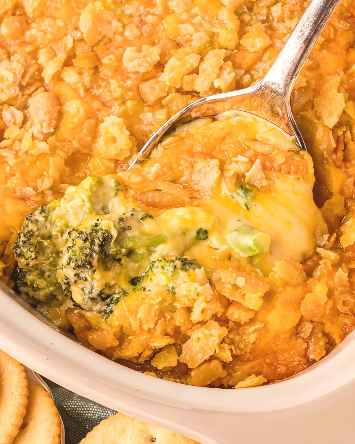 Southern broccoli casserole baked with a creamy cheese sauce and a crunchy cracker topping as a traditional Thanksgiving side dish