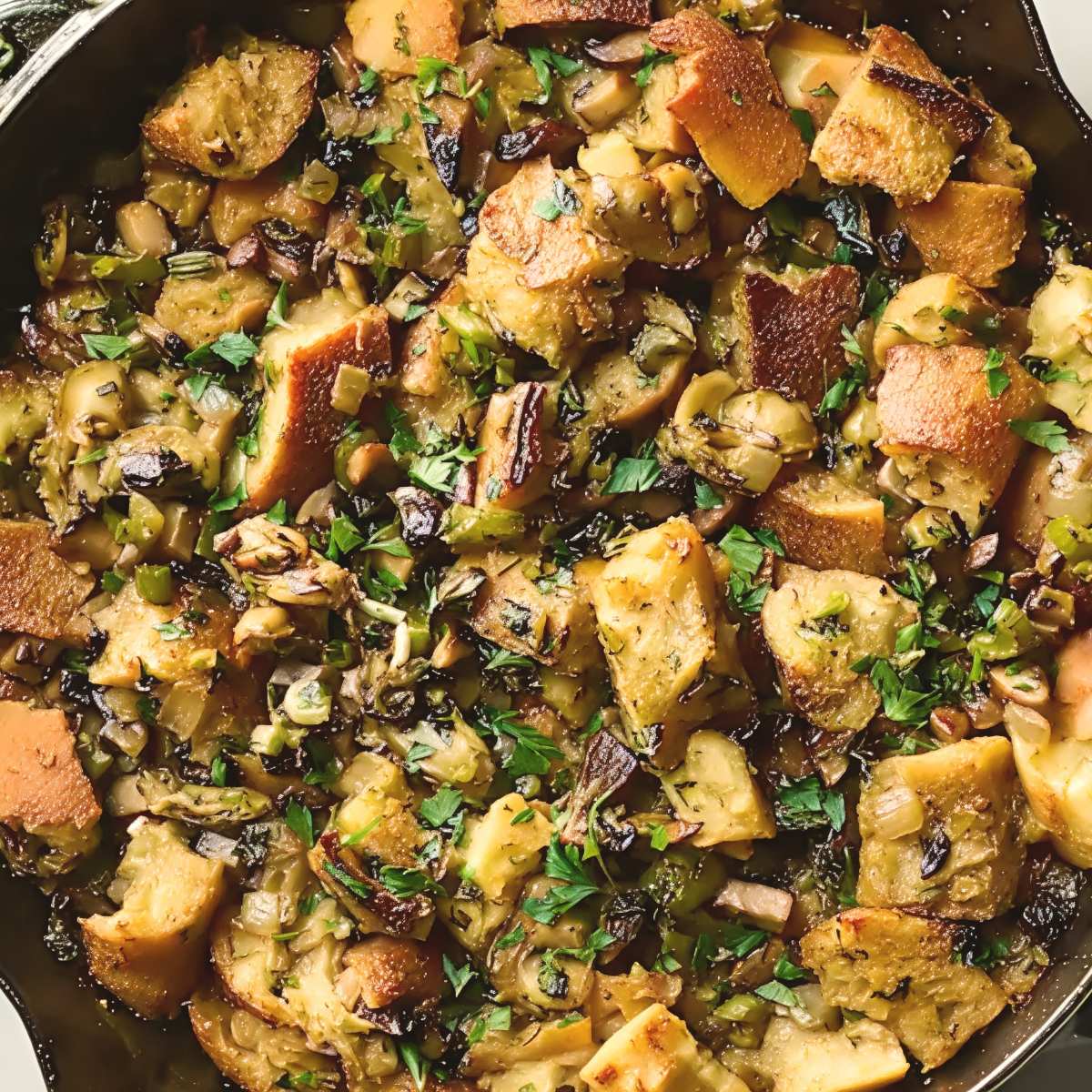 Here are a few SEO-optimized alt text options for your southern oyster dressing image: Option 1 (Best for general SEO & keyword-rich): Southern oyster dressing baked in a skillet with seasoned cornbread cubes, herbs, and savory oysters as a traditional Thanksgiving side dish